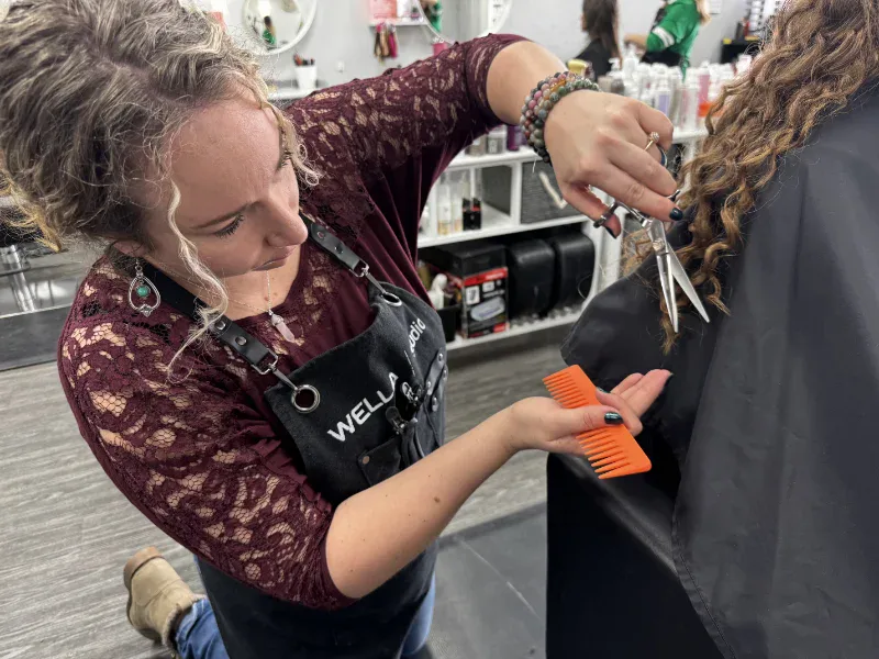 Alexis performing a dry curly haircut using freehand Curl Craft Cut technique in Red Deer Alexis performing a dry curly haircut using freehand Curl Craft Cut technique in Red Deer