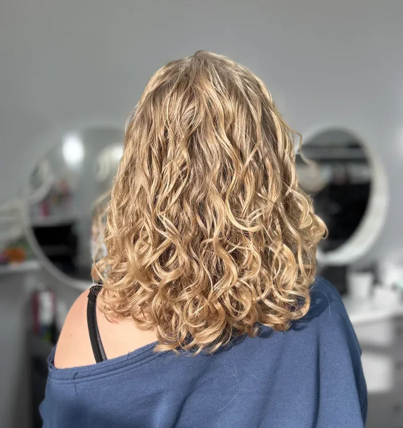Finished Curly Haircut Showing Natural Texture and Defined Curls at Sharper Image Hair Design in Red Deer Finished Curly Haircut Showing Natural Texture and Defined Curls at Sharper Image Hair Design in Red Deer