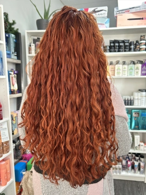 Long copper red hair with natural curl by Alexis