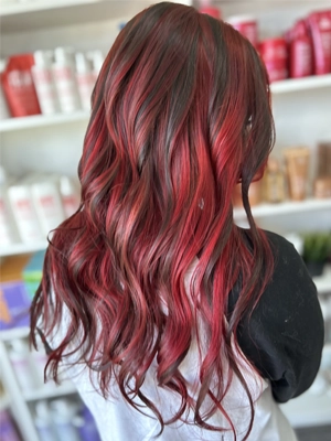 Dark hair with vivid red panels and waves by Alexis