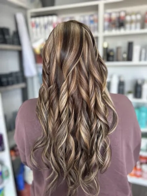 Long bronde hair with soft waves by Alexis