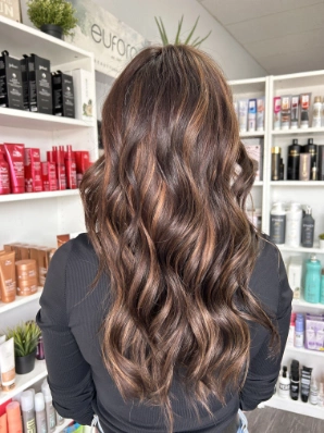 Rich brunette with warm caramel highlights by Alexis