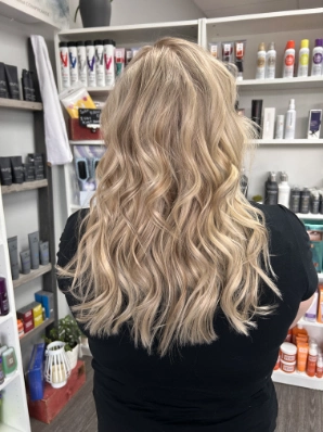 Long buttery blonde with loose waves by Alexis