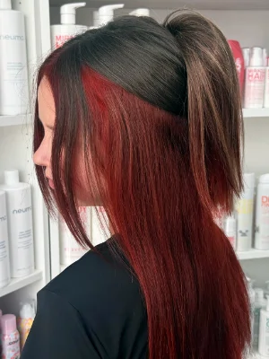 Dark hair with bright red underlayer by Alysha