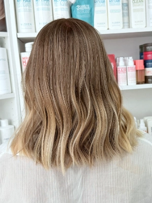 Blonde balayage with darker rooted base by Alysha