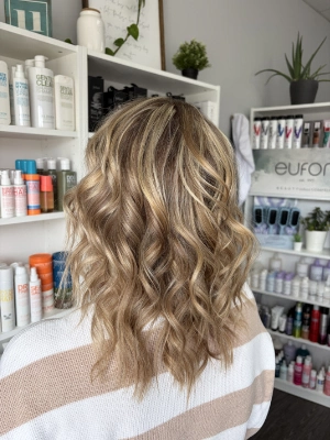 Sandy blonde with textured waves by Breanna