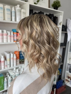 Shoulder-length blonde balayage with waves by Breanna