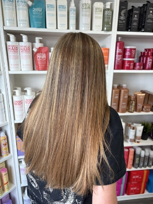 Long bronde with warm highlights by Breanna