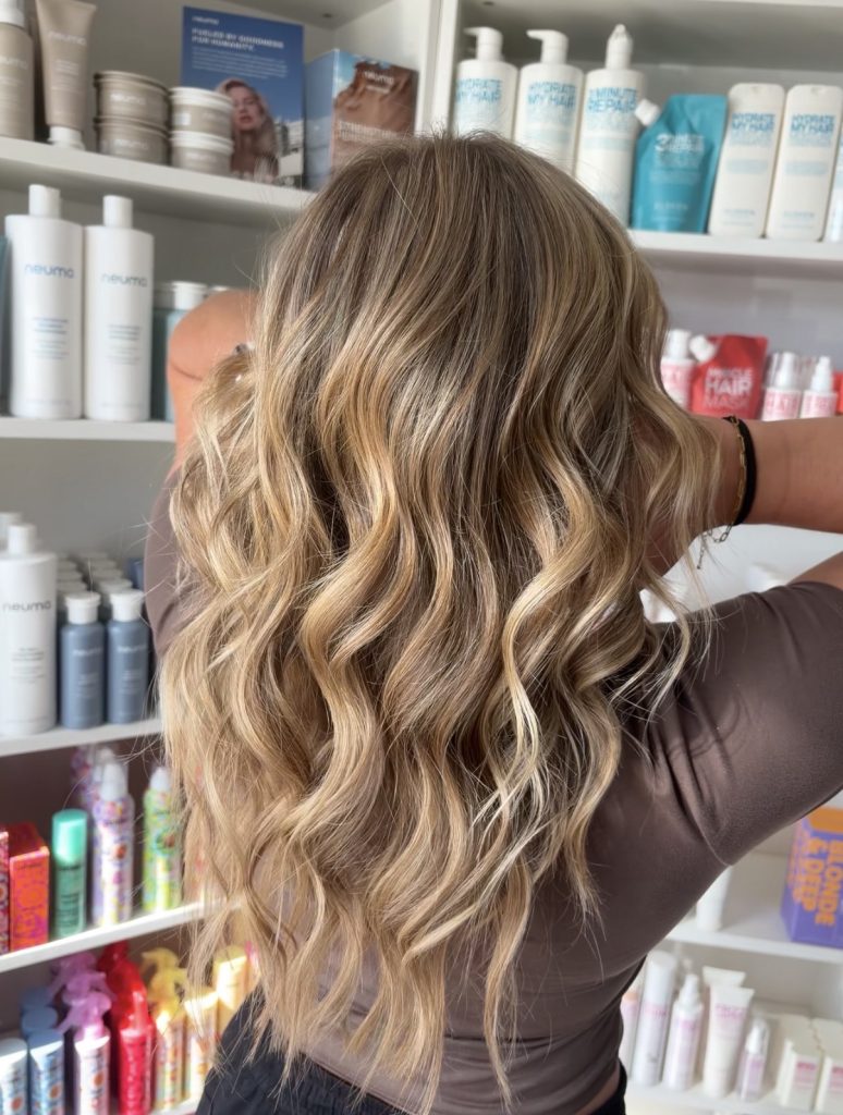 Long golden blonde with soft waves by Breanna