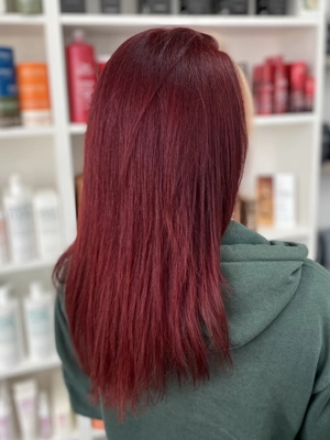 Long vivid red hair with straight finish by Chloe