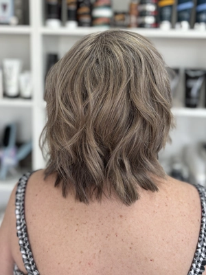 Shoulder-length layered shag in ash blonde by Jenn