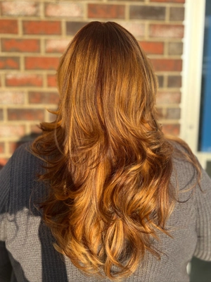 Long copper orange hair with soft waves by Katelyn