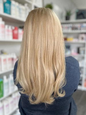 Long platinum blonde with sleek straight finish by Katelyn