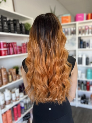 Long copper orange hair with loose waves by Madi