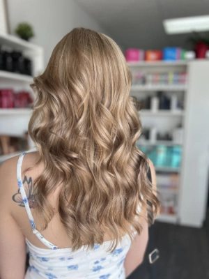 Long sandy blonde with soft waves by Madi