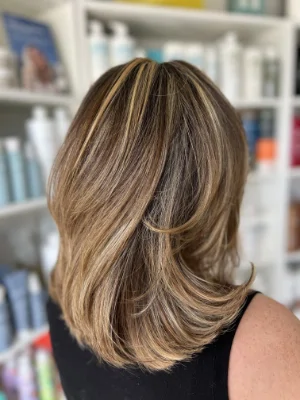 Long bronde with face-framing highlights by Madi
