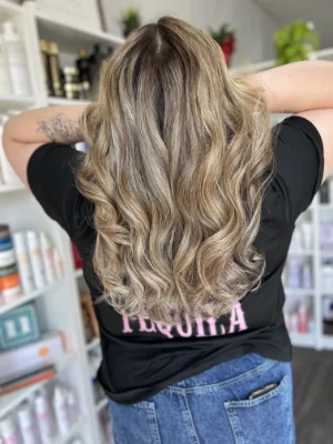 Sandy blonde with sun-kissed highlights by Madi