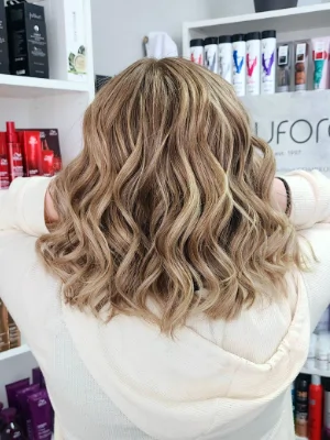 Shoulder-length ash blonde with soft curls by Sherri