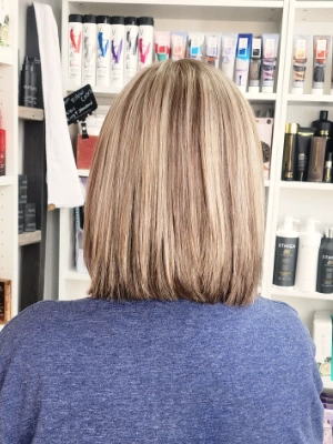 Shoulder-length blonde with sleek straight finish by Sherri