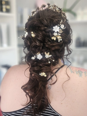 Braided updo with white flowers by Sherri