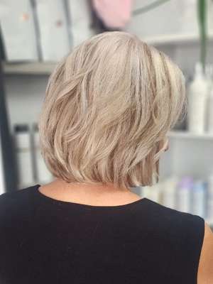 Short blonde bob with soft texture by Sherri