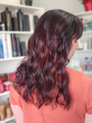 Dark hair with burgundy red underlayer by Sherri