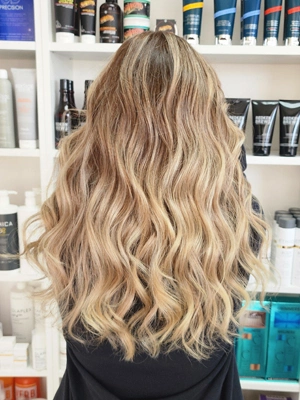 Long blonde with beachy textured waves by Sherri